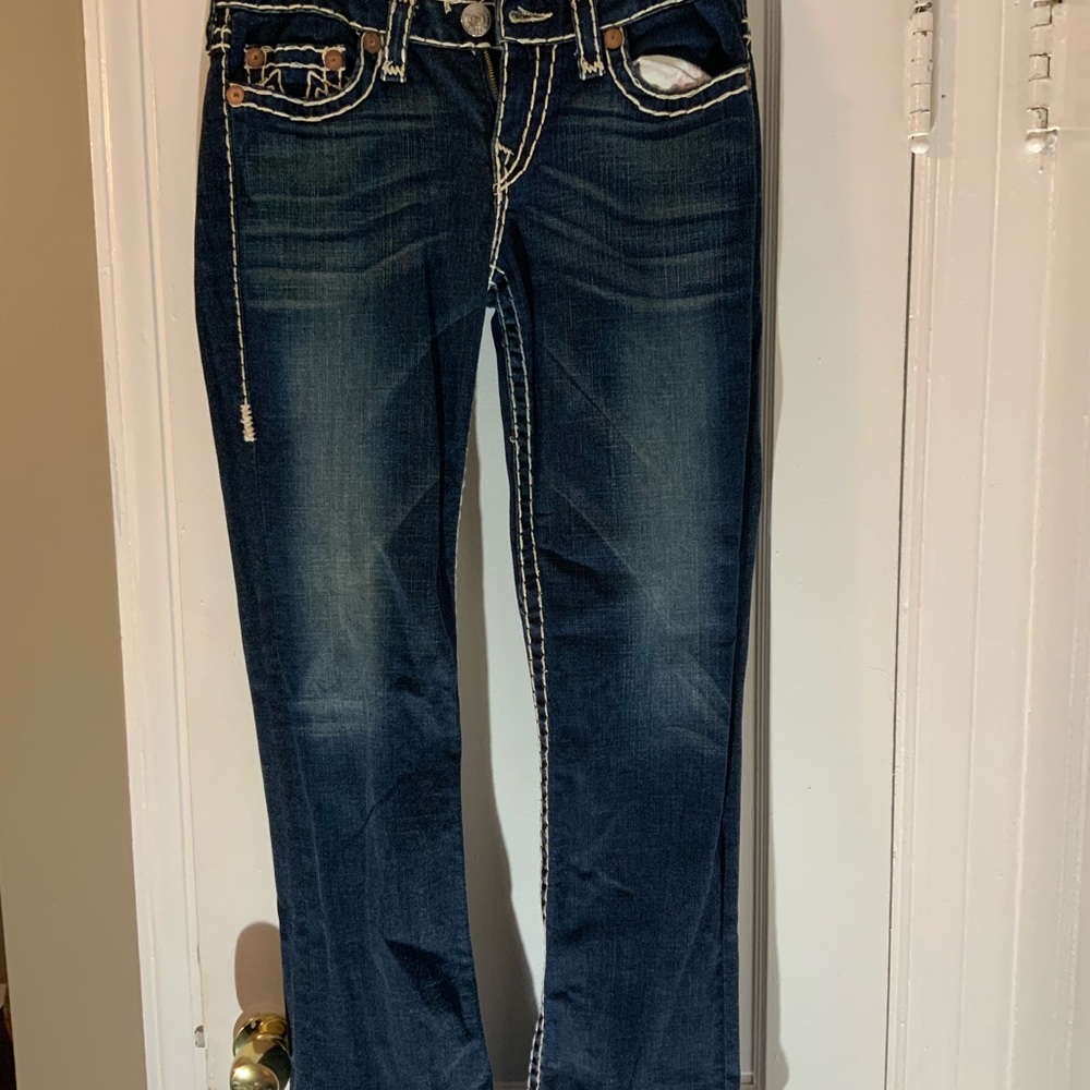 True Religion dark denim stretch jean with white stitching in a size 31waist